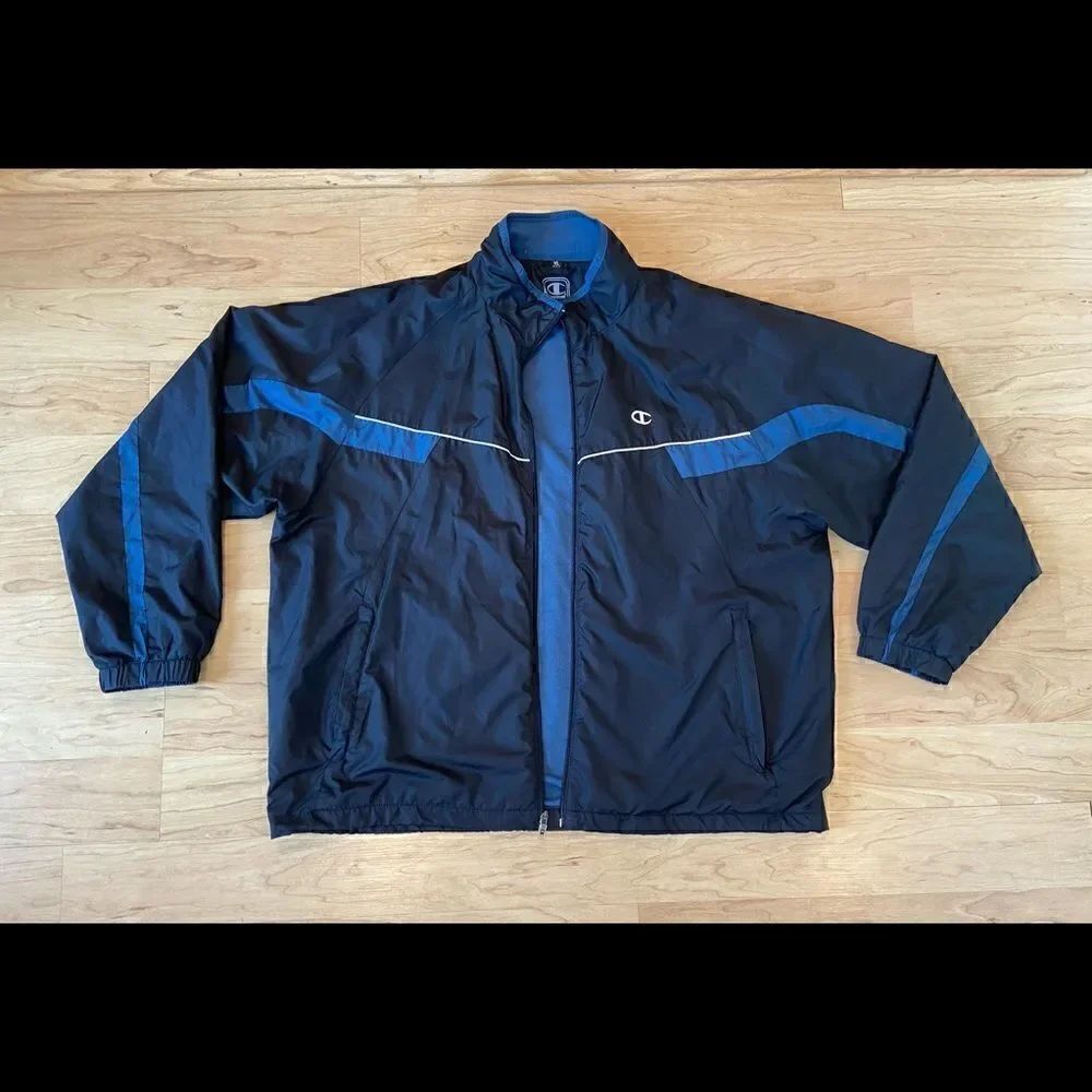 Champion black and blue full zip windbreaker. Size XL.